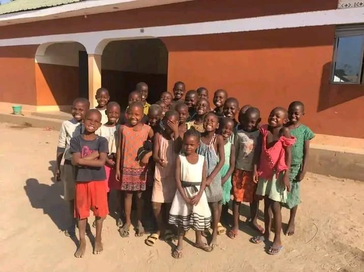 Volunteers playing with orphaned children